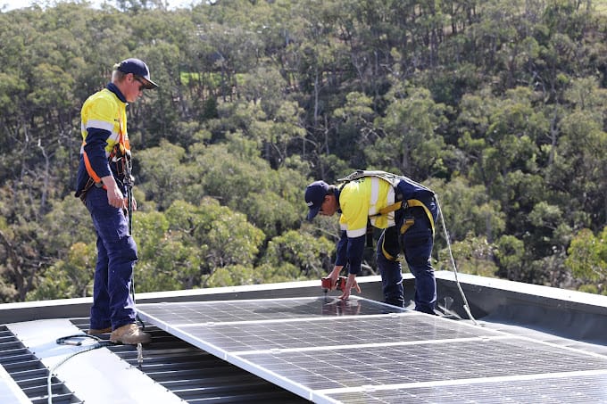 Solar panel installation by crew in the Adelaide Hills